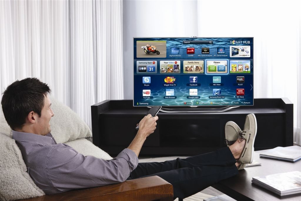 man in front of tv
